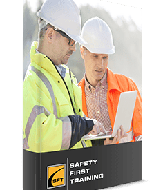 Two men in hard hats and safety vests looking at a tablet.
