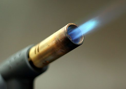 A close up of the flame on a gas burner