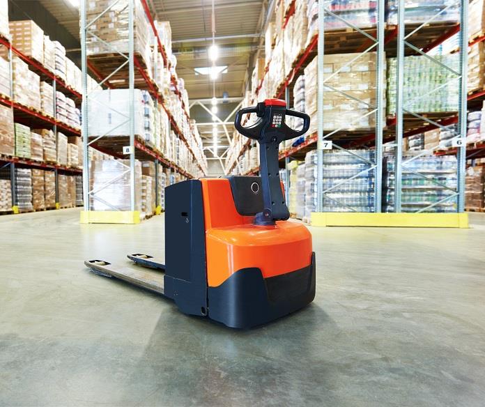 A large warehouse with a forklift in it.
