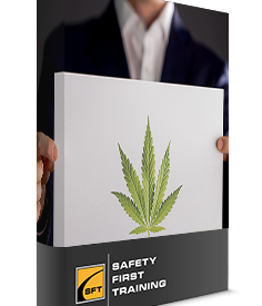 A man holding up a picture of marijuana leaf.